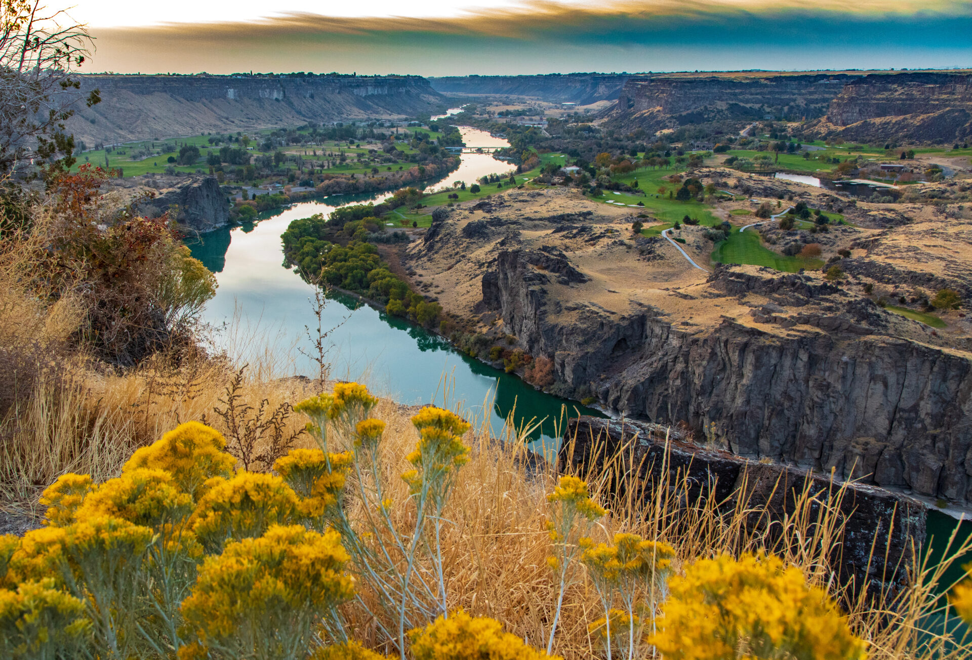 Snake river with wild flowers at sunset in Twin Falls Idaho
